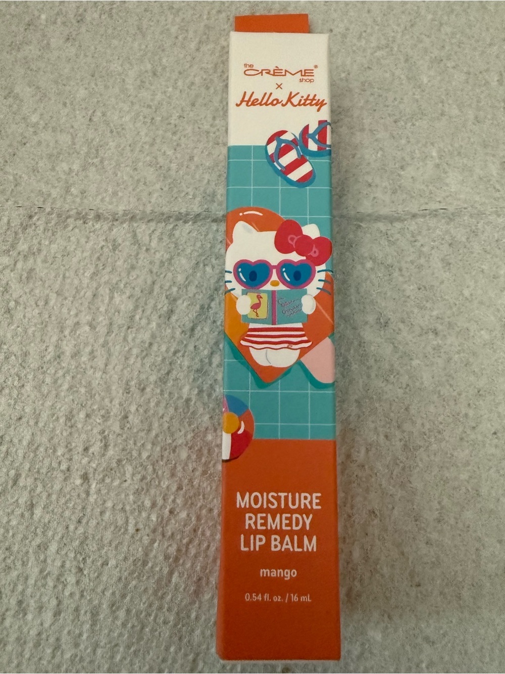 The Crème Shop x Hello Kitty Moisture Remedy Lip Balm NIP- MANGO